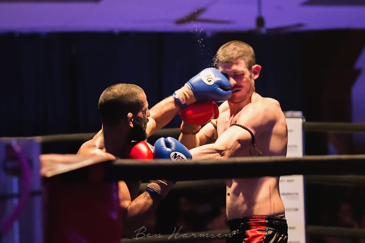 Fighter landing a clean punch mid-round